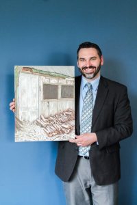 Dr. Matthew Klooster displays his oil paintings, which are inspired by the landscapes that he comes across while simply driving in his car.
