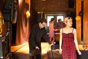Junior Jonathan Hunt and sophomore Sue Choi set up for a Mus Musculus performance at the Warehouse last week. Both are officers in Centre Encore and perform in the band.